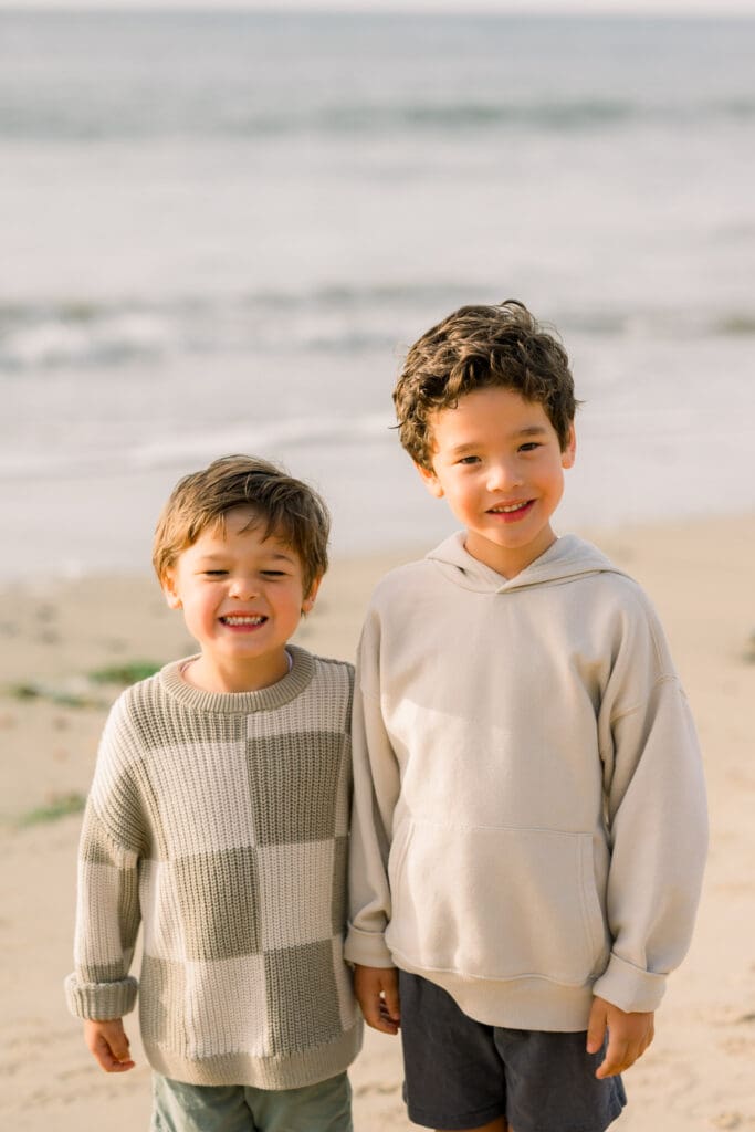Brothers in sweaters during their family beach photo session in the South Bay.