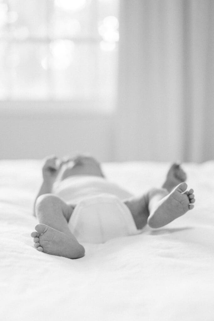 A black and white photo of a newborn baby taken during an in home newborn photography session in Los Angeles.