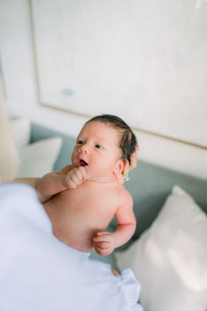 A newborn baby posing for in home newborn photos in Los Angeles.
