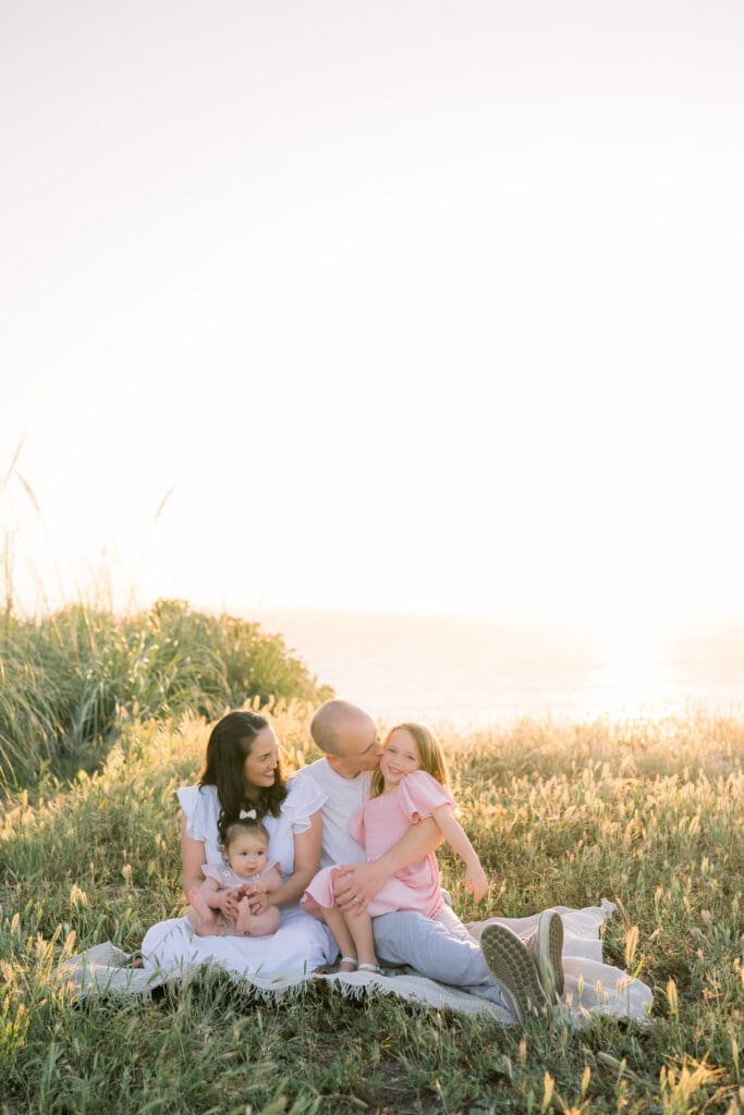 A family posing together at the Palos Verdes Cliffs during their spring family portrait session.