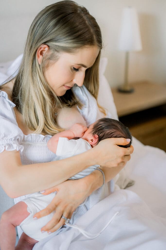 For moms wondering what to wear for newborn photos, a white flowy dress is perfect.