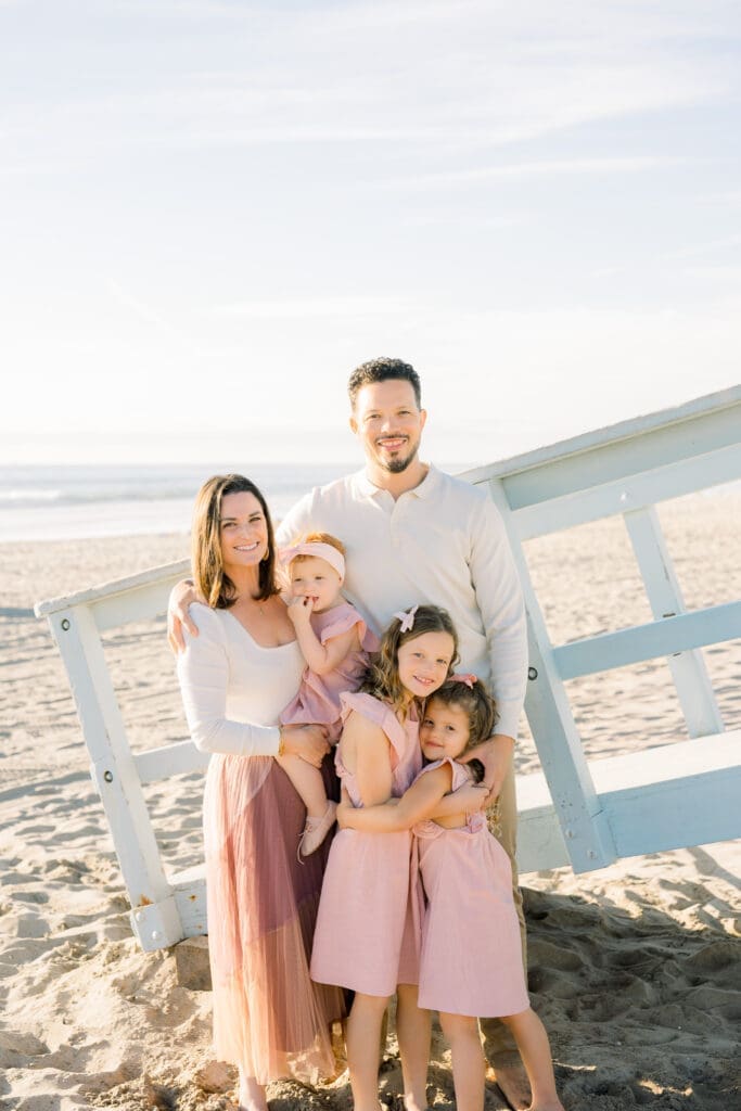 A family photo session in Manhattan Beach with a family of 5 on the beach.