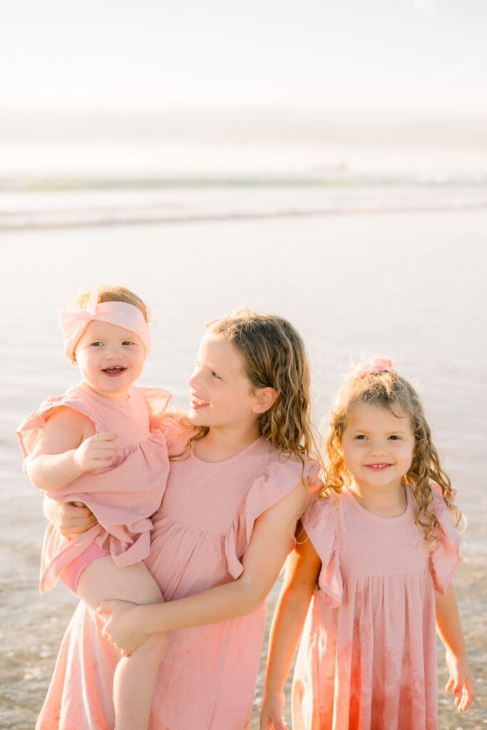 Sisters taking family photos with a South Bay photographer.
