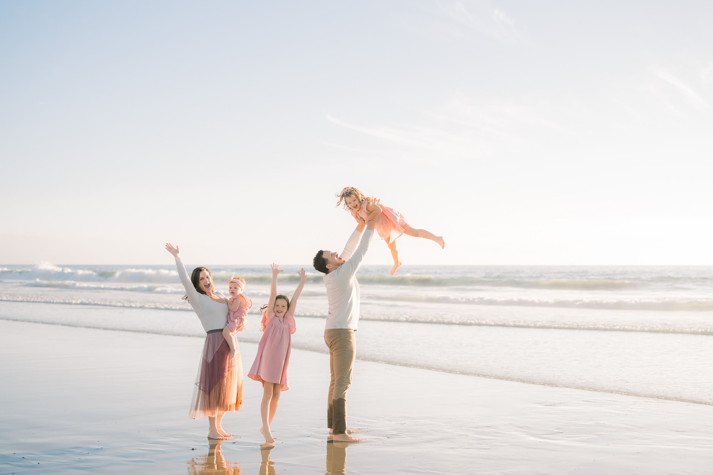 A family photo session with a family of 5 on the beach taken by a South Bay photographer.