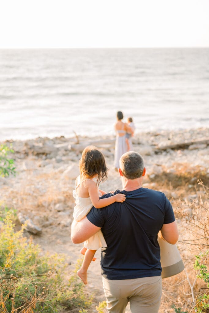A family walking towards the beach.